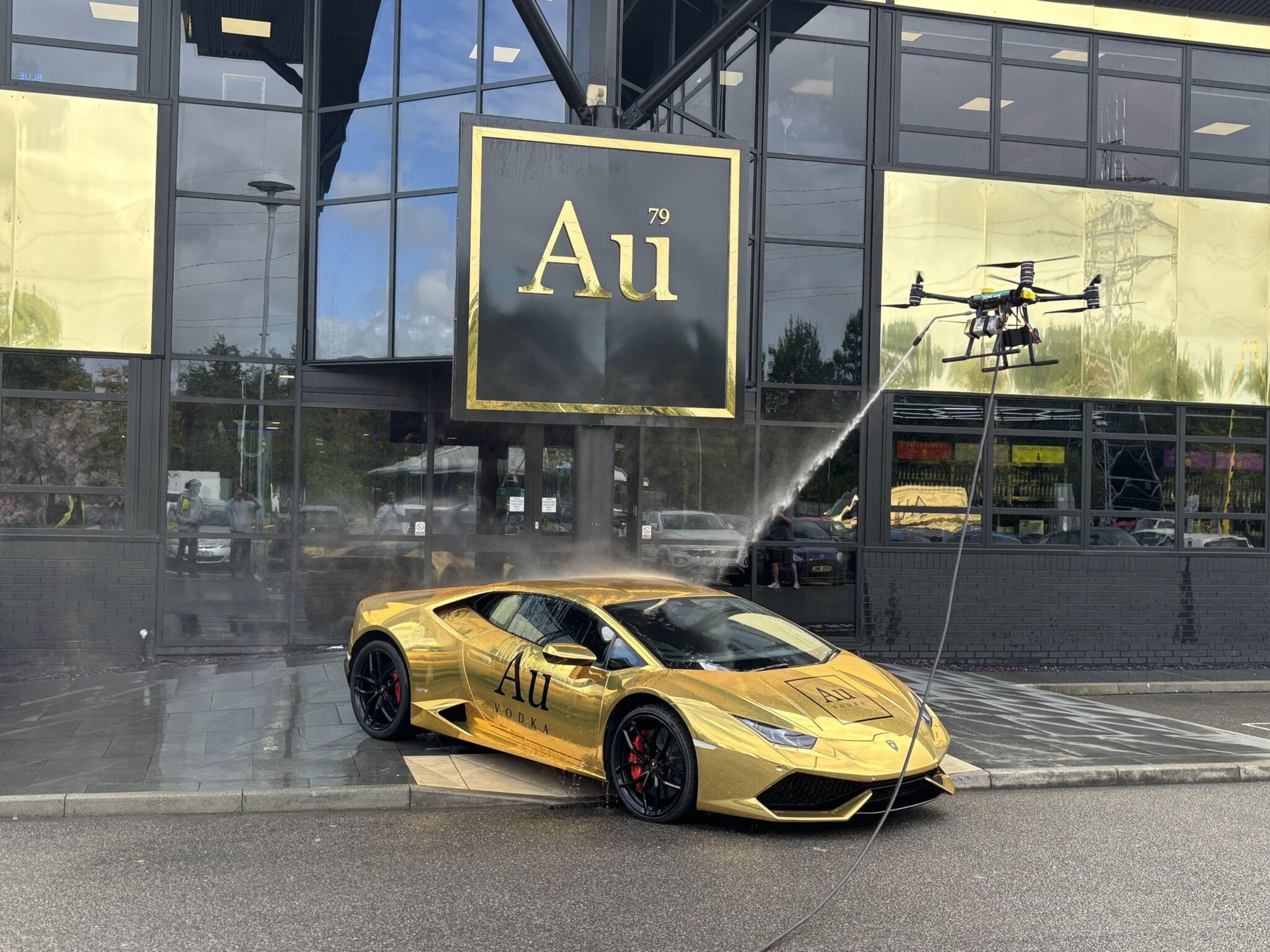 Apellix drone washing gold Lamborghini at Au Vodka