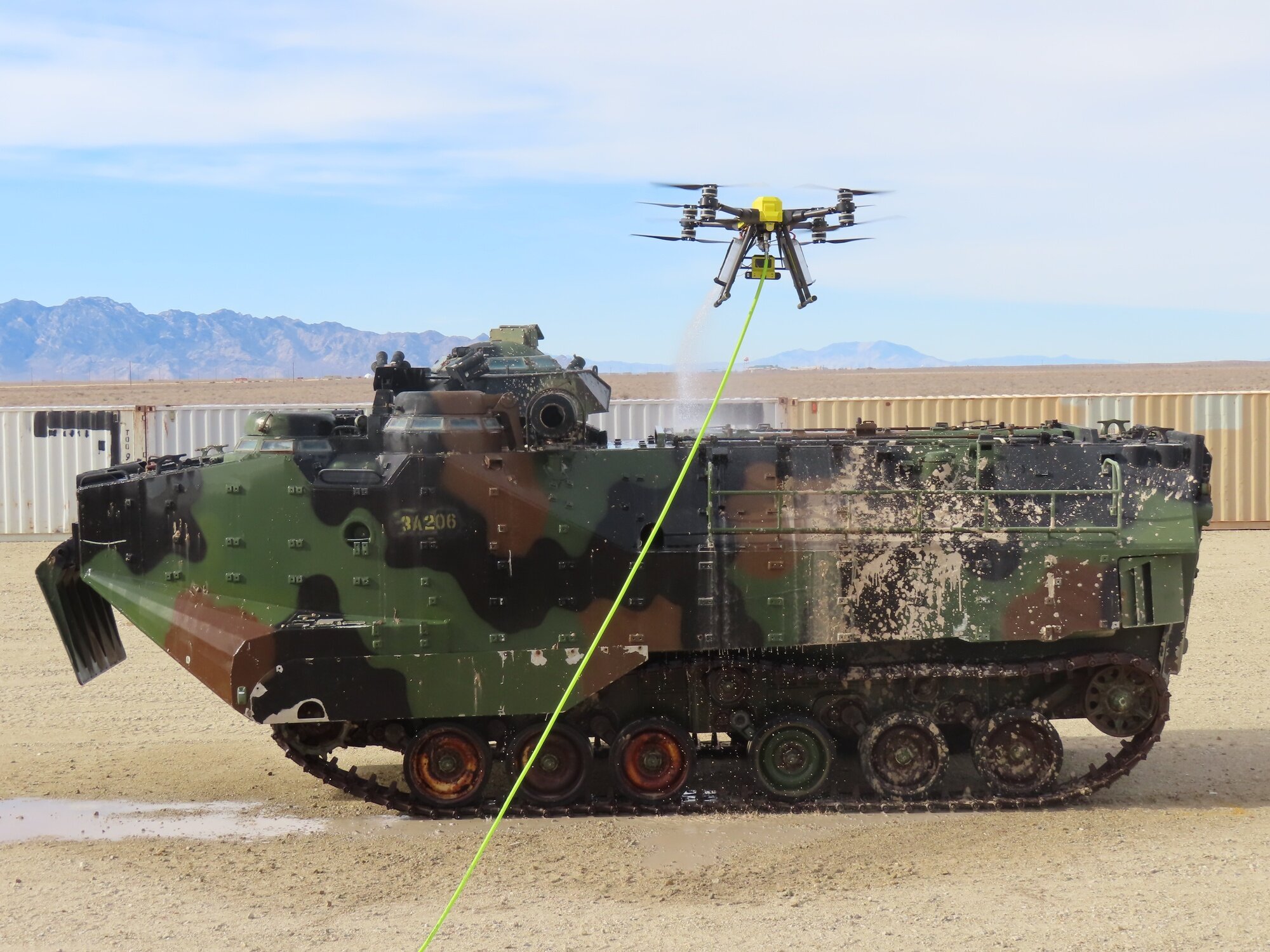 Apellix drone decontaminating military vehicle
