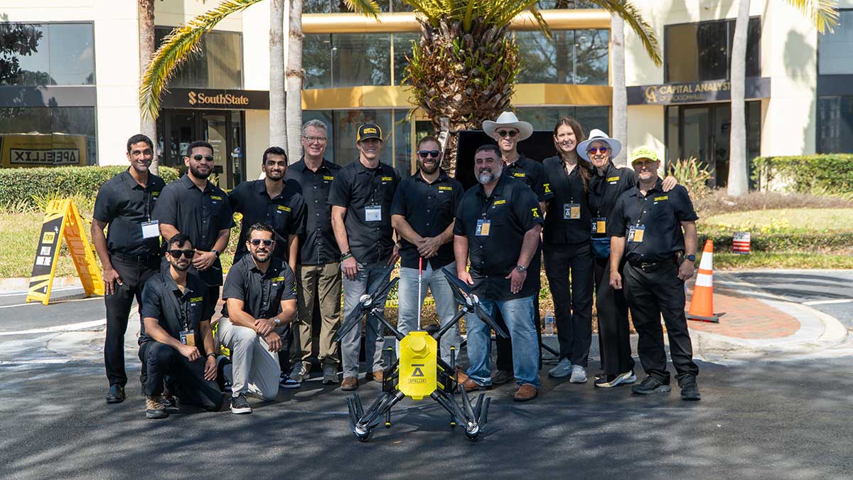 The Apellix team posing with their drone at company headquarters